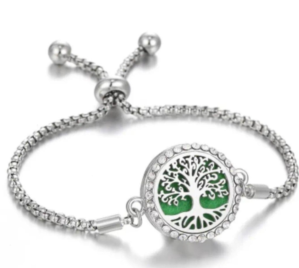 Adjustable Tree of Life bracelet with hair or ash cast in with epoxy resin.